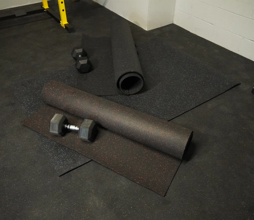![Durable black rubber gym flooring rolls with red speckles](#placeholder_link)